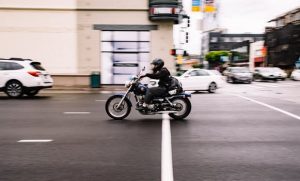A person riding a motorcycle on the streets of Brazil.