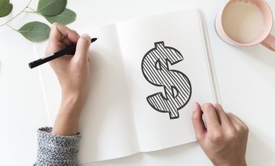 Today, we put the dollar mark on a notepad and piece of paper.