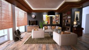 A living room - chairs, a sofa, a TV, shelves and paintings on the wall